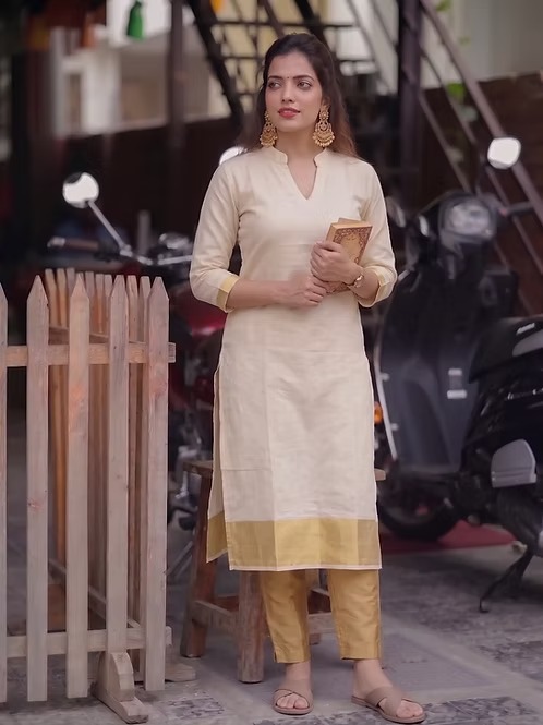 Golden kasavu tissue kurti standing view