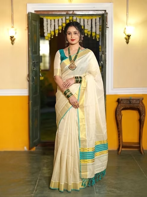 Kasavu tissue saree with turquoise blue border and stripes front view