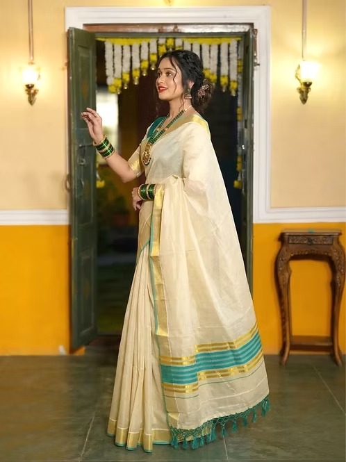 Kasavu tissue saree with turquoise blue border side view