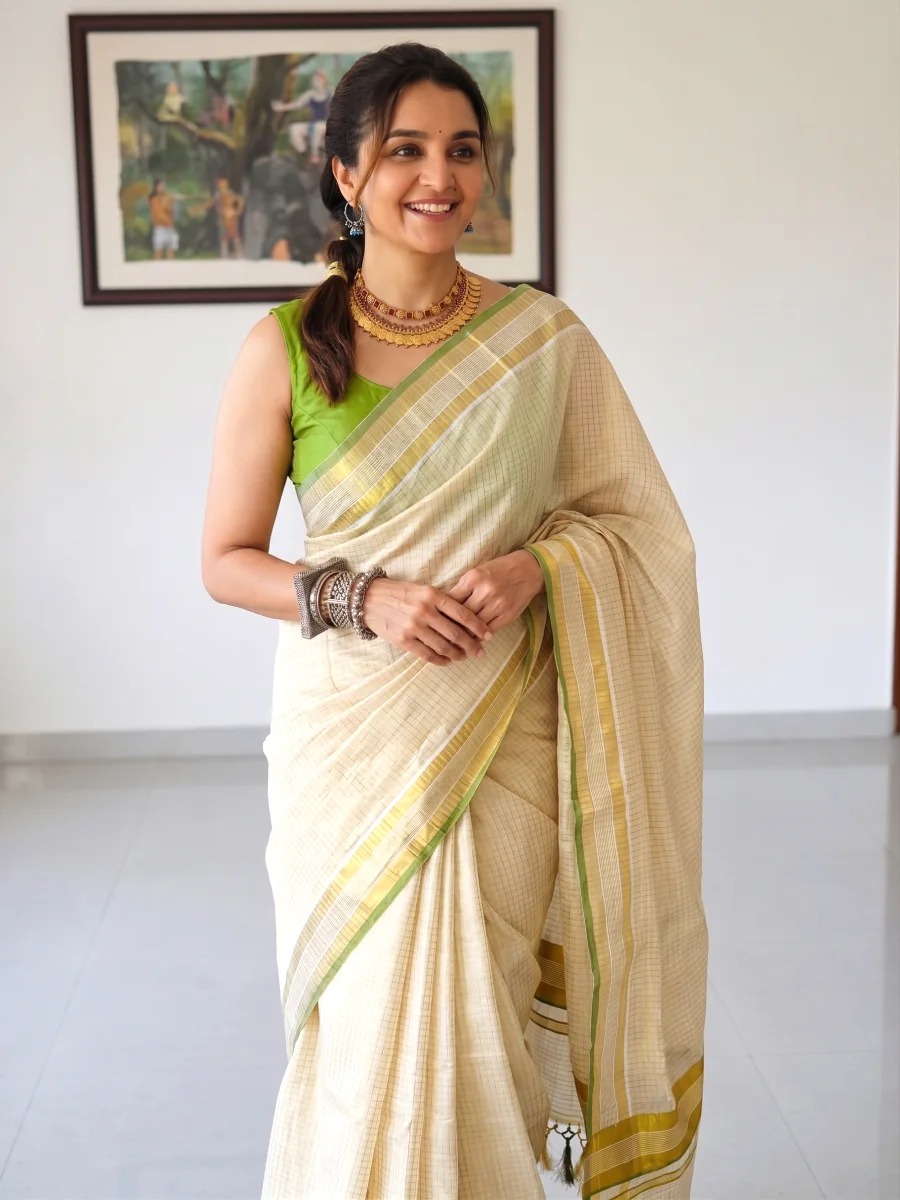 Traditional pea green tiny checks kasavu saree front view
