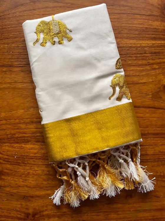 Golden Gajah embroidery cotton Kerala kasavu saree folded view